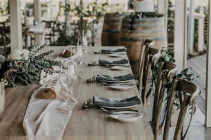 Dining tables with blush chiffon runners