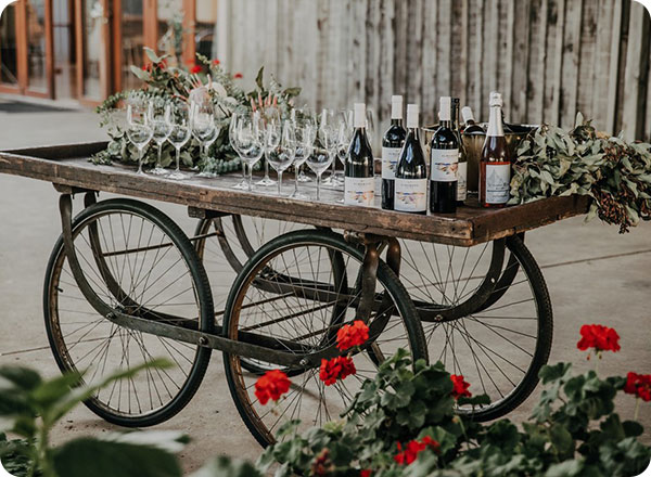 Photo shows a rustic cart setup as a bar