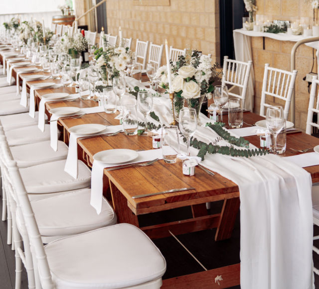 Tables and chairs setup for country wedding