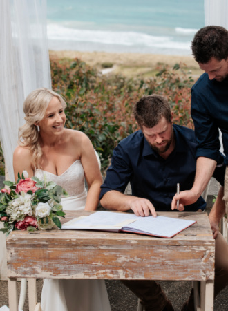 Newlyweds at the signing table