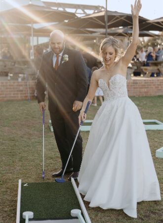 Bride playing Mini Golf during her wedding at Phillip Island Winery