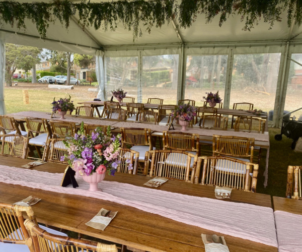 tables and chairs setup at a marquee wedding