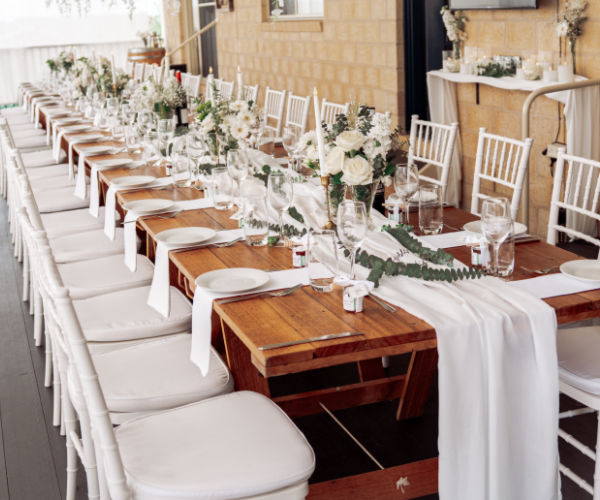tables and chairs setup at a home wedding