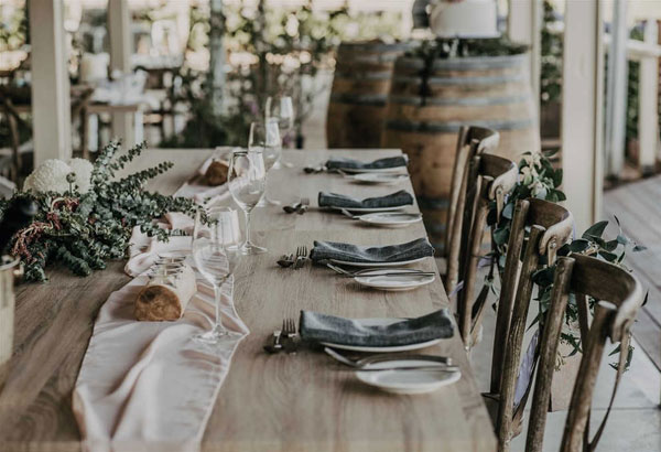 Dining tables with blush chiffon runners