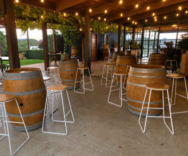Wine barrels and stool setup for an event in the Yarra Valley