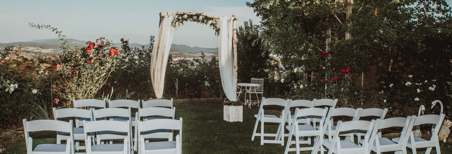 A wedding ceremony setup amongst the trees overlooking the Yarra Valley